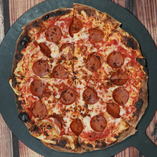 Fire & Char Vegan Classic Pizza – Be-Hive mozzarella, vegan pepperoni, and sausage over zesty tomato sauce. Plant-based and packed with flavor in Richmond VA.
